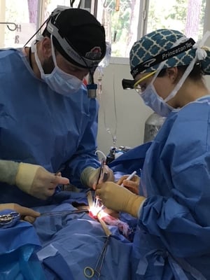 Dr. Justin Gusching performing a surgical procedure on a patient in Guatemala with HELPS International